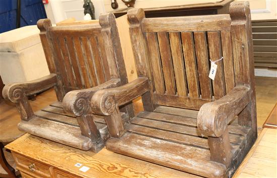 A pair of scroll arm coachmans chairs, with no bases or legs W.55cm